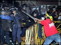 An anti-coup protester clashes with police in the Thai capital Bangkok